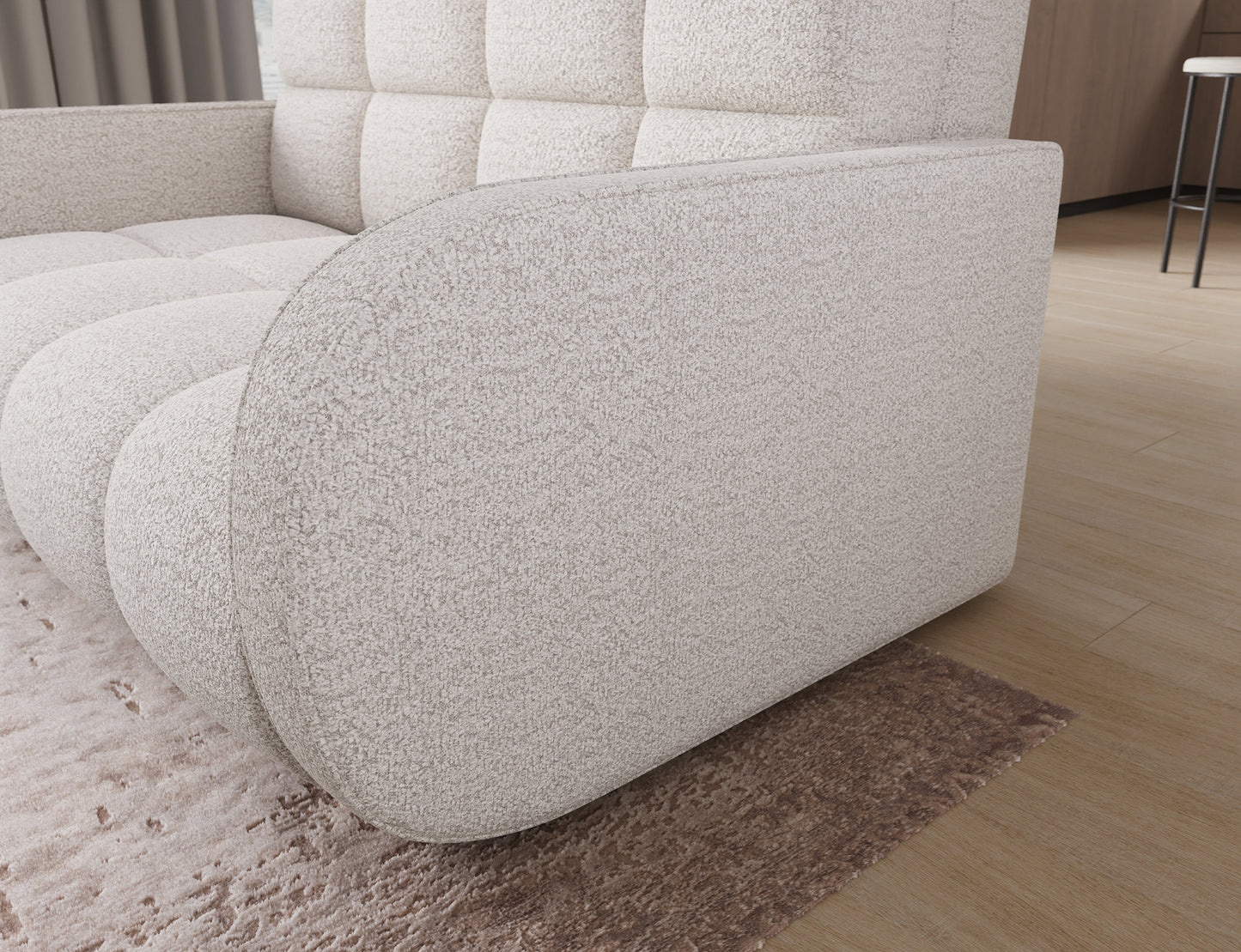 Sofa Deverio Royal 01 biały boucle – bok amerykanki z zaokrąglonym wykończeniem i tapicerką typu boucle.