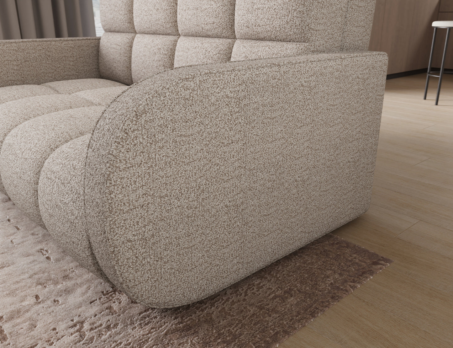 Sofa Deverio Royal 18 jasnobeżowy boucle – bok amerykanki z zaokrąglonym wykończeniem i miękką tkaniną typu boucle.