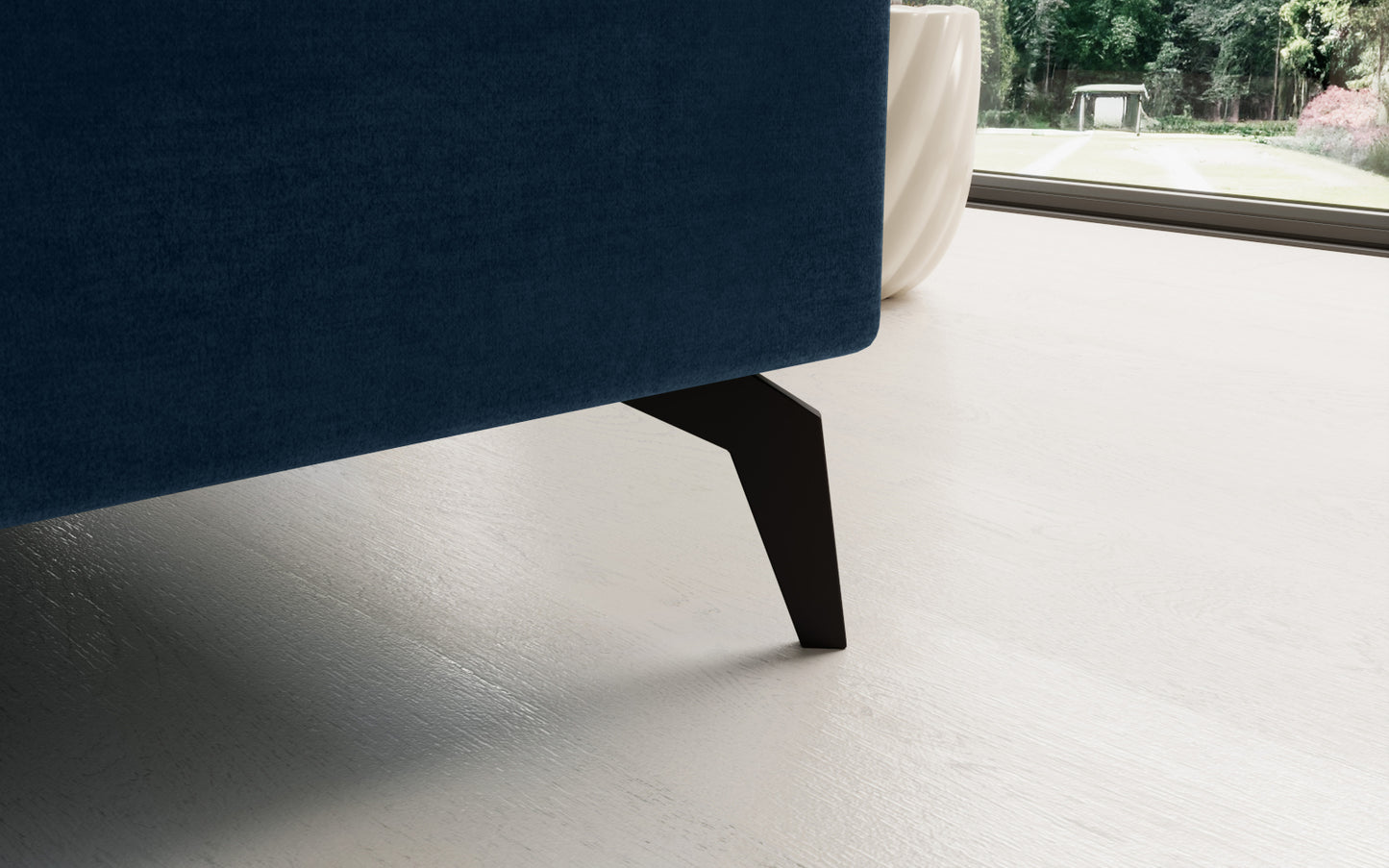 Niebieski narożnik Solange Monolith 77 prawostronny to designerski mebel do salonu, który dzięki pikowaniom i miękkim poduszkom tworzy przytulną i stylową strefę wypoczynku.