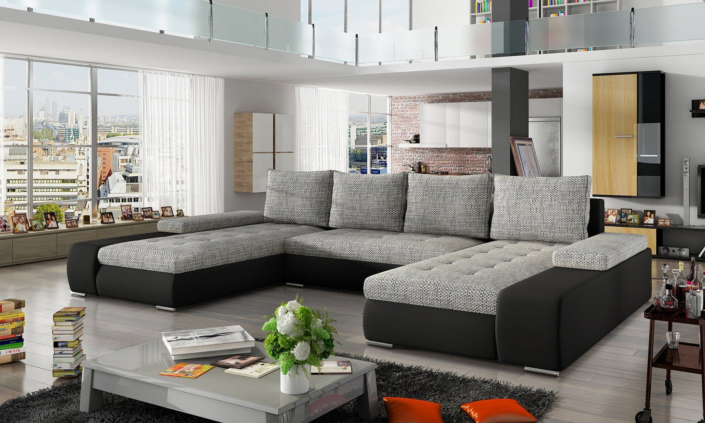 Stylowy narożnik do salonu Marino w kolorystyce szaro-czarnej, wykonany z tkaniny Berlin 01 i ekoskóry Soft 11, oferuje dużą powierzchnię wypoczynkową i wyrazisty, elegancki charakter.