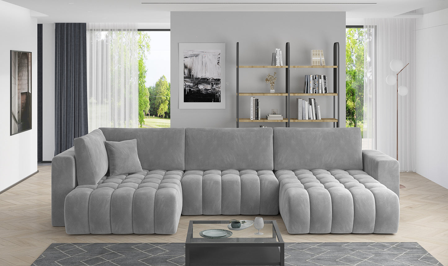 Designerski narożnik Bonito w jasnoszarej tkaninie Sola 04 zachwyca efektownym pikowaniem oraz nowoczesną bryłą. Duży narożnik do rodzinnego salonu łączy komfort użytkowania z modnym wyglądem i przytulnym wykończeniem.