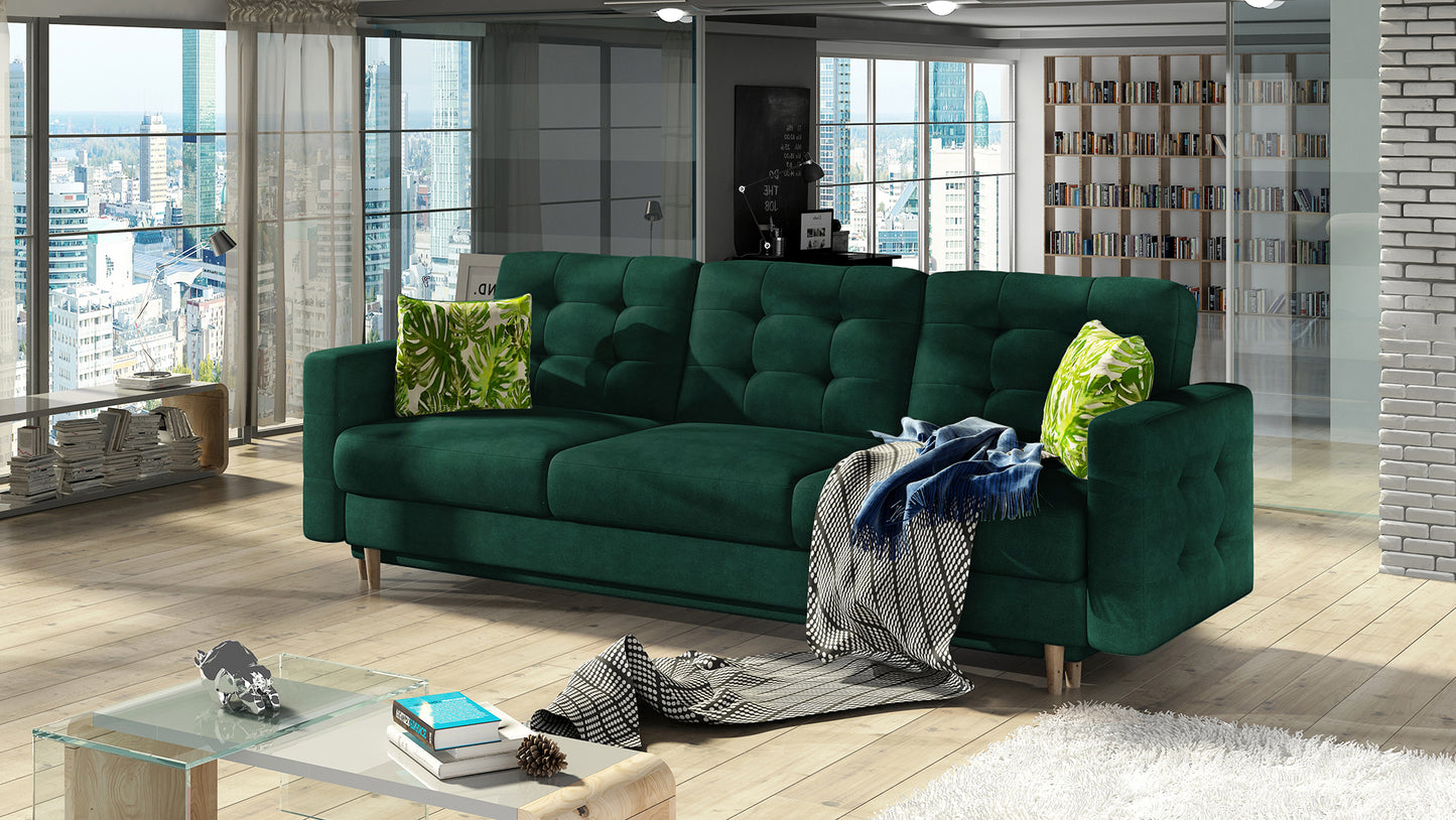 Kanapa Asgard Kronos 19 zielony / Jungle 32 wielokolorowy w nowoczesnym salonie – elegancki mebel z funkcją spania i dekoracyjnymi poduszkami.