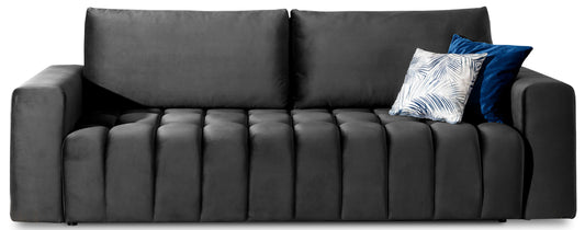 Sofa Lazaro Monolith 97 ciemnoszary, frontowy widok na białym tle z pikowanym siedziskiem i dwoma dekoracyjnymi poduszkami w odcieniach granatu i wzoru liści.