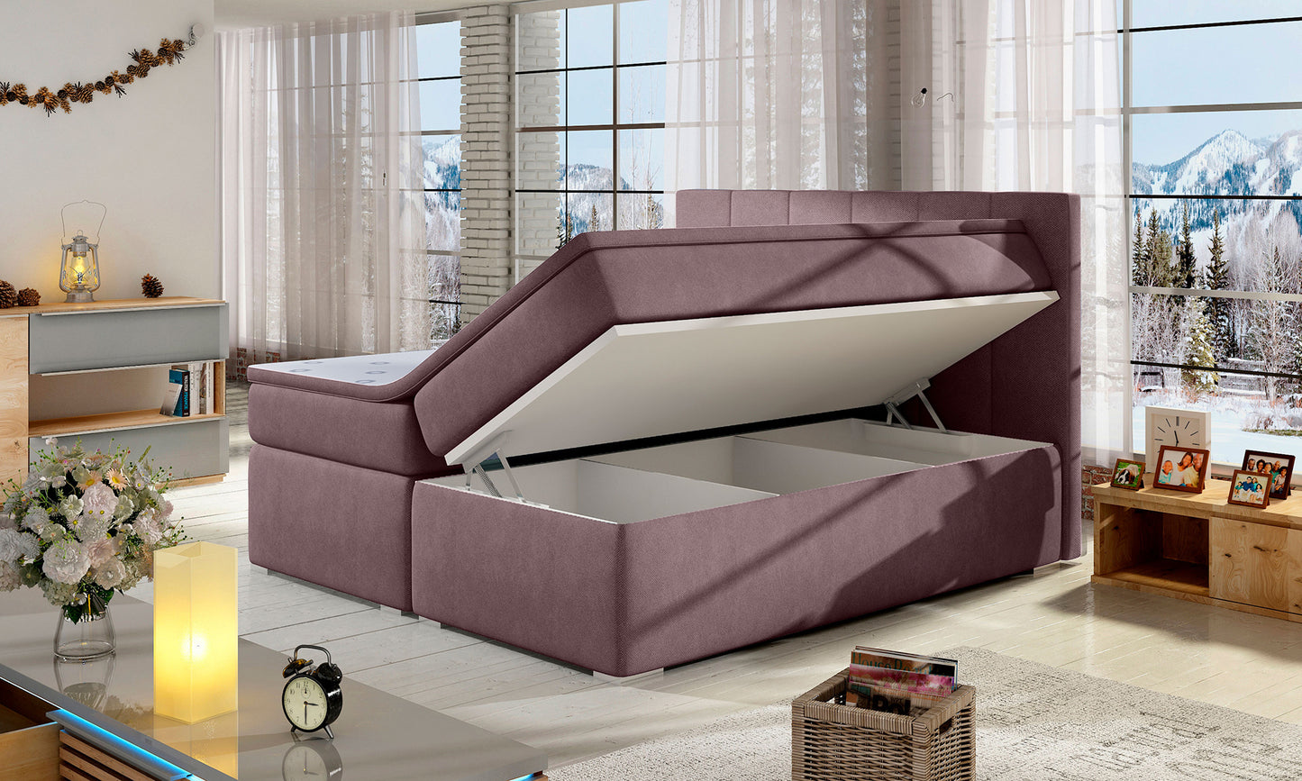 Łóżko Bolero 160x200 Soro 65 jasnofioletowy z pojemnikiem na pościel – uniesiony stelaż pokazujący przestrzeń do przechowywania.