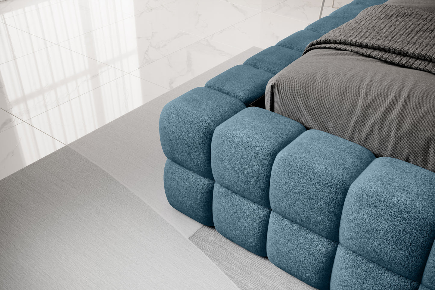 Detal narożnika łóżka Dizzle 180x200 cm w tkaninie Amore 40 granatowy, ukazujący miękkie tapicerowane wykończenie w stylowym, minimalistycznym wnętrzu.