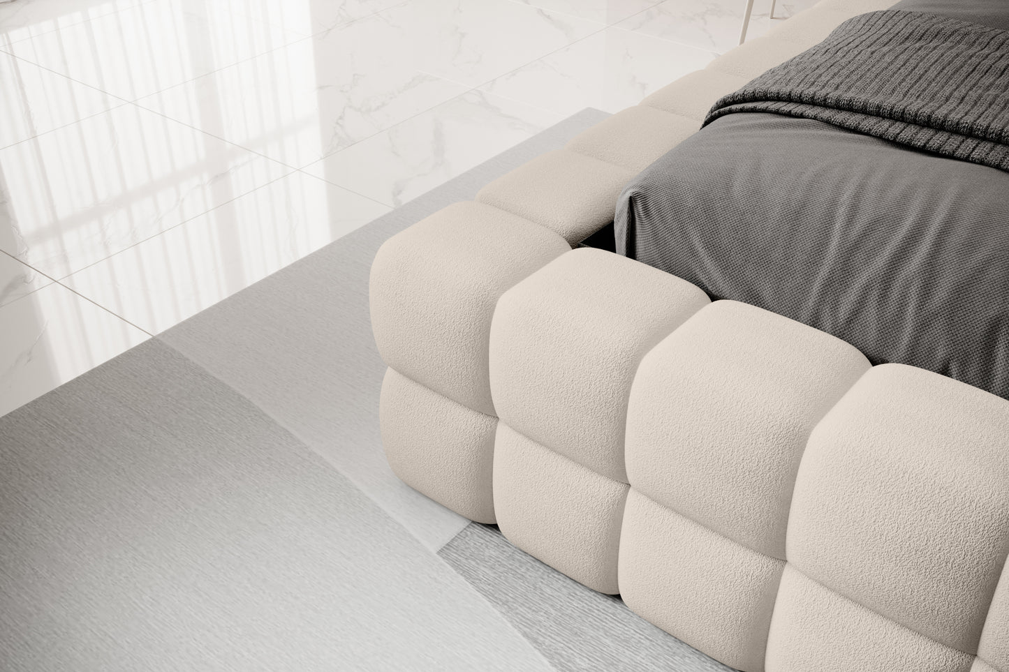 Detal narożnika łóżka Dizzle 140x200 cm w tkaninie Touch 18 jasnobeżowy, ukazujący miękkie tapicerowane wykończenie w stylowym, minimalistycznym wnętrzu.