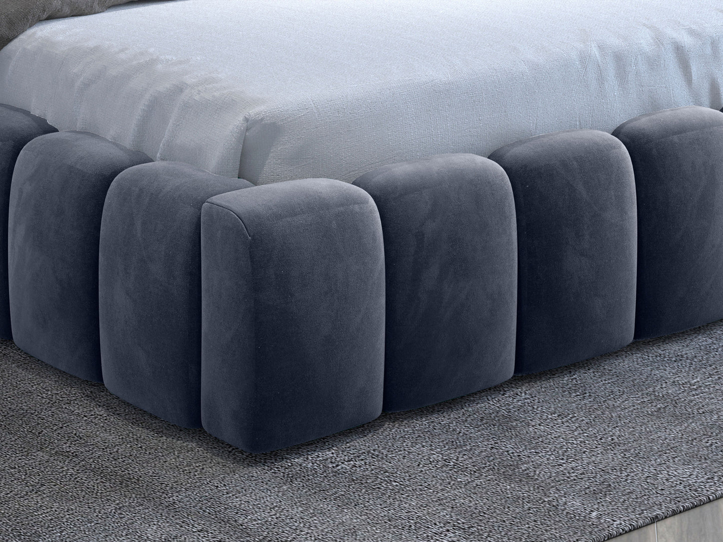 Detal zaokrąglonych, modułowych paneli tapicerowanej podstawy łóżka Lamica II Monolith 97 ciemnoszary.