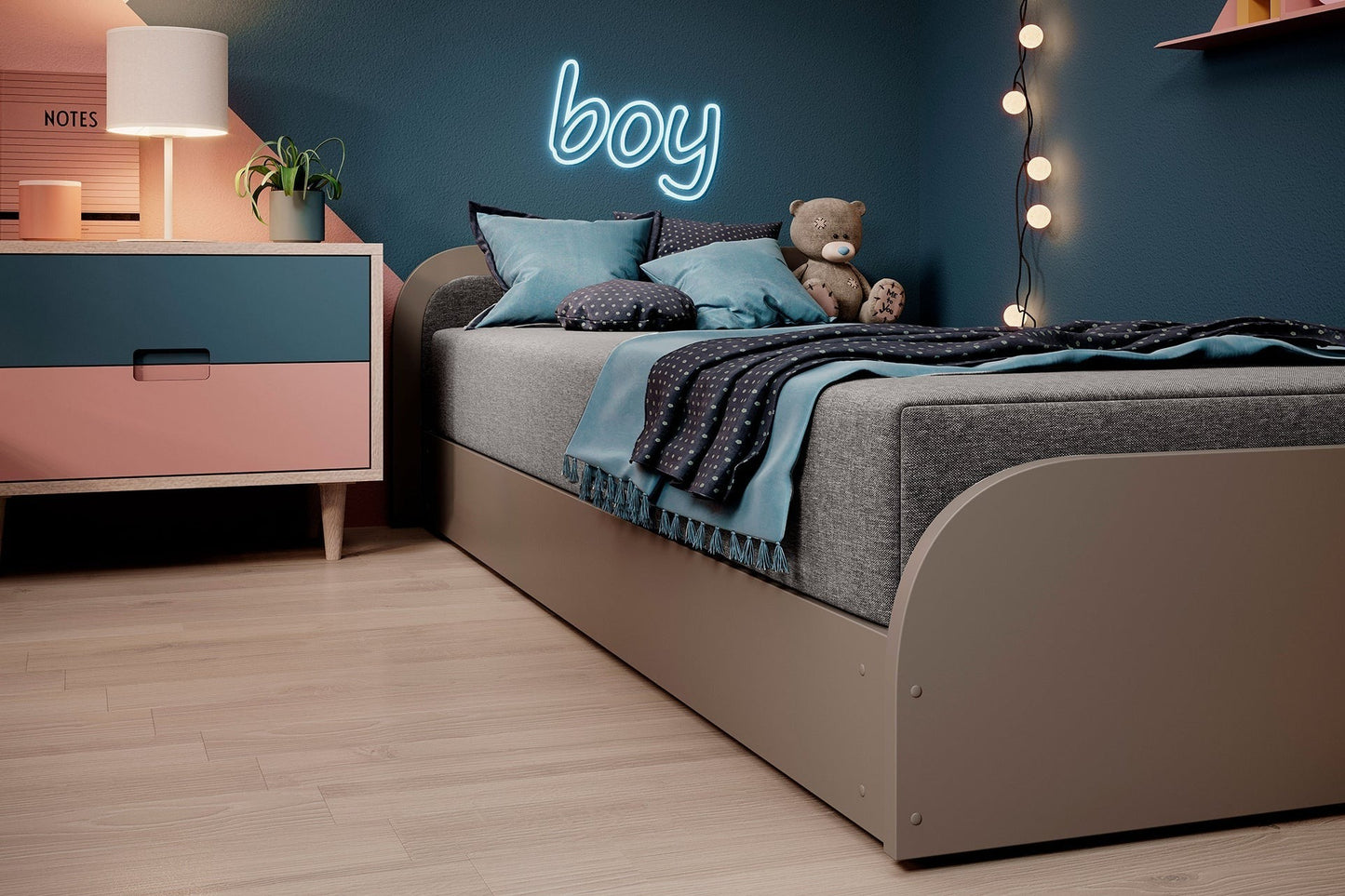 Front łóżka Parys I Sawana 21 (szary) z lewej strony, pokazujący zaokrąglony, lakierowany przód i kontrastowe przeszycie materaca.