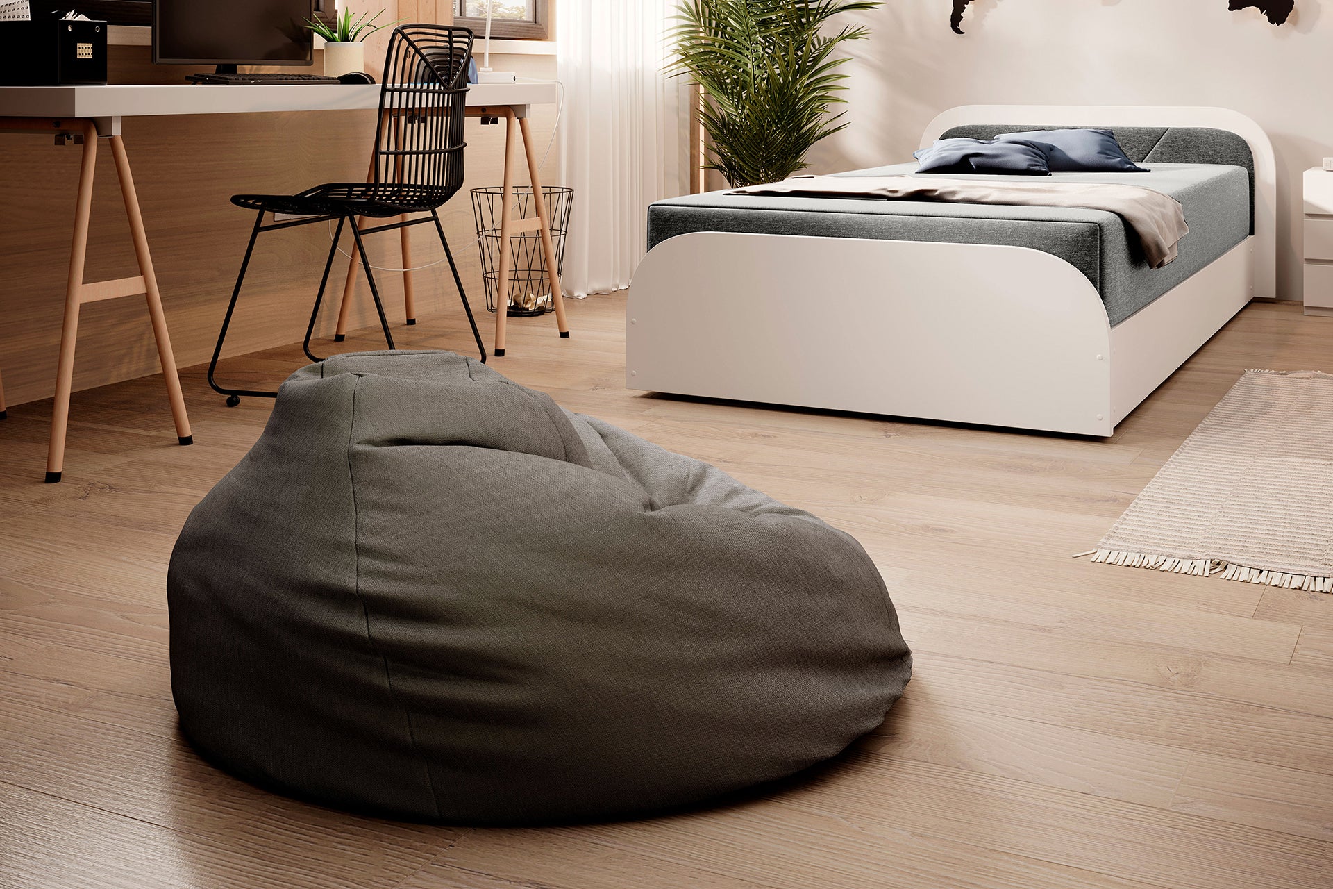 Ujęcie wnętrza: łóżko Parys I Sawana 21 szary w prawym układzie, przy stylizowanej mapie świata, pufie i biurku na tle jasnej, drewnianej podłogi.