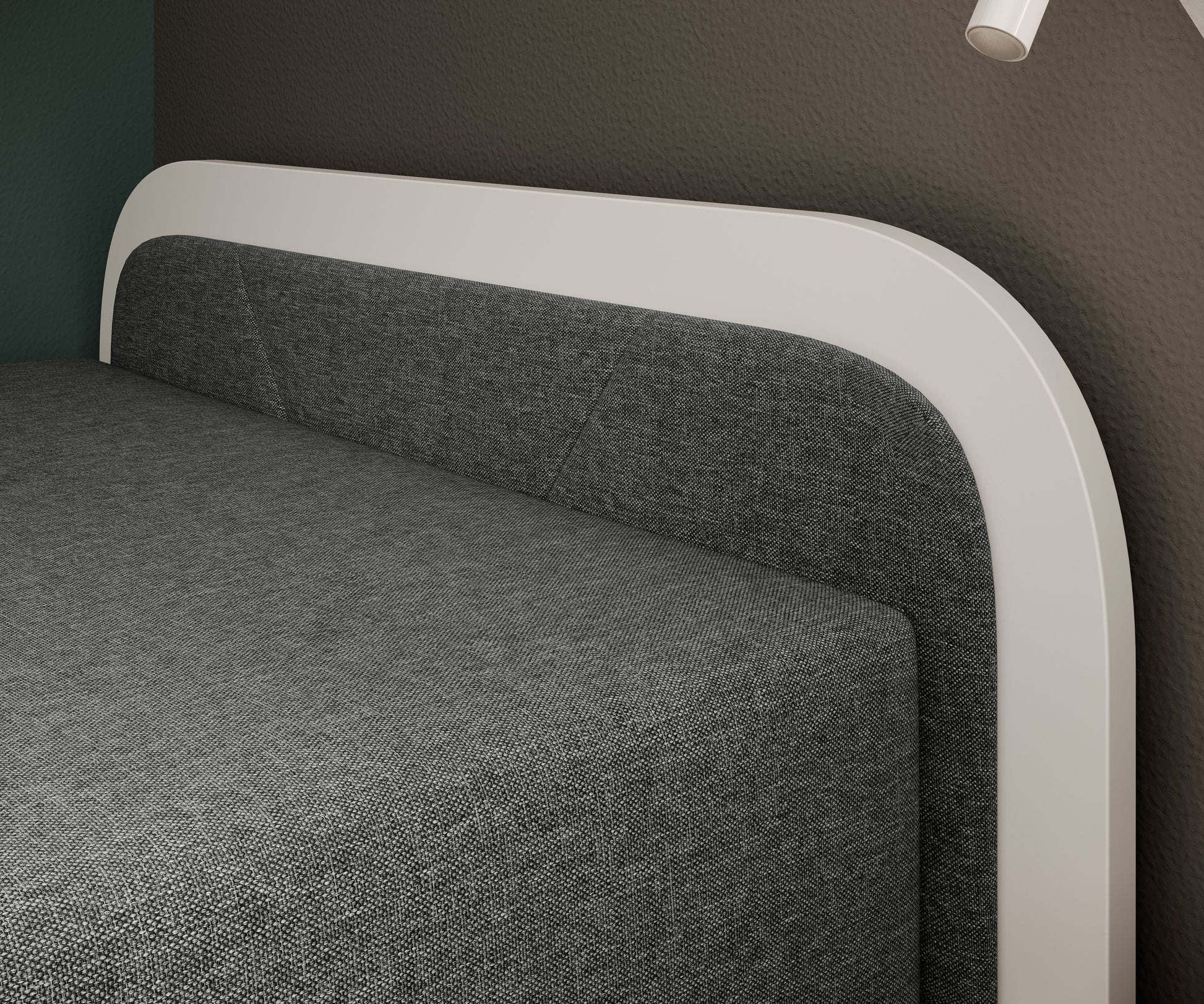 Detal zagłówka łóżka Parys I w Sawana 21 szary: tapicerowany, zaokrąglony panel otoczony białą ramą.