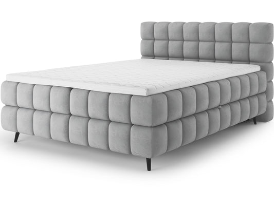 Łóżko kontynentalne Sabeno w tkaninie Calmora 04 szary, z eleganckim wezgłowiem i metalowymi nogami – styl, komfort i nowoczesny design.