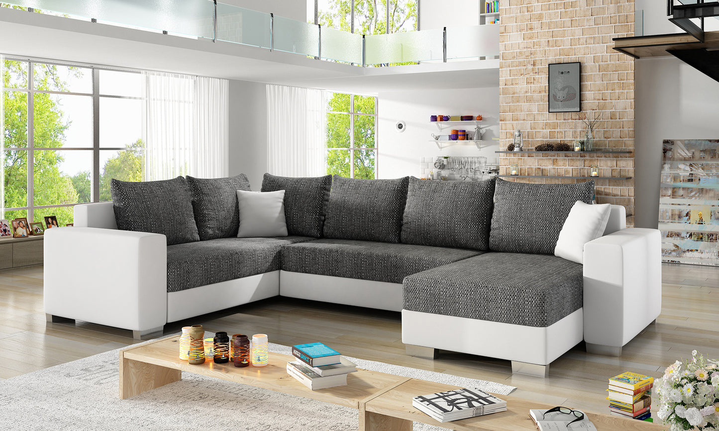 Narożnik Marco Berlin 02 czarny z eko skórą Soft 17 białą, ustawiony w nowoczesnym, jasnym salonie w aranżacji dziennej
