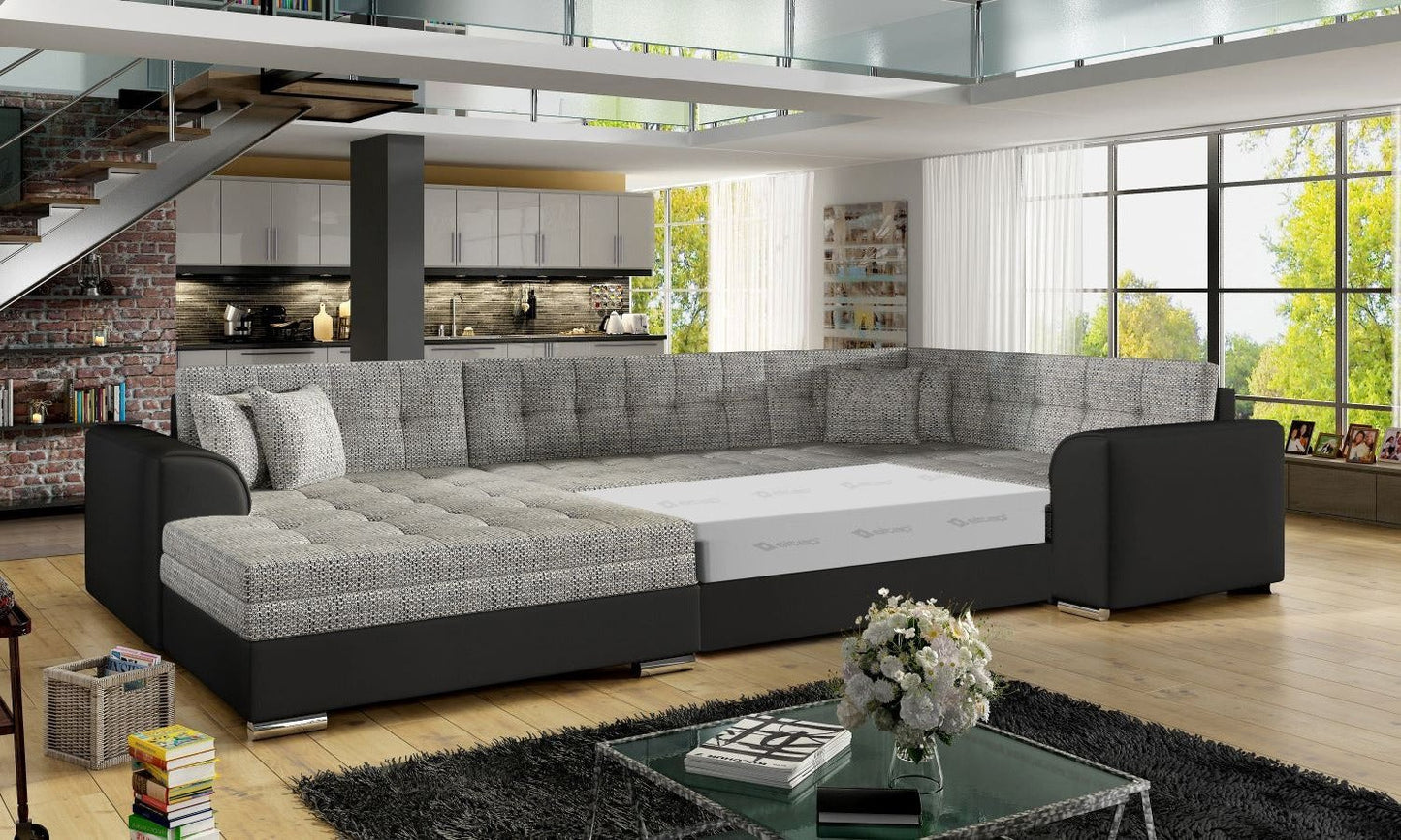 Narożnik Damario w kolorze szarym i czarnym z rozłożoną funkcją spania, prezentacja powierzchni przeznaczonej do wypoczynku.