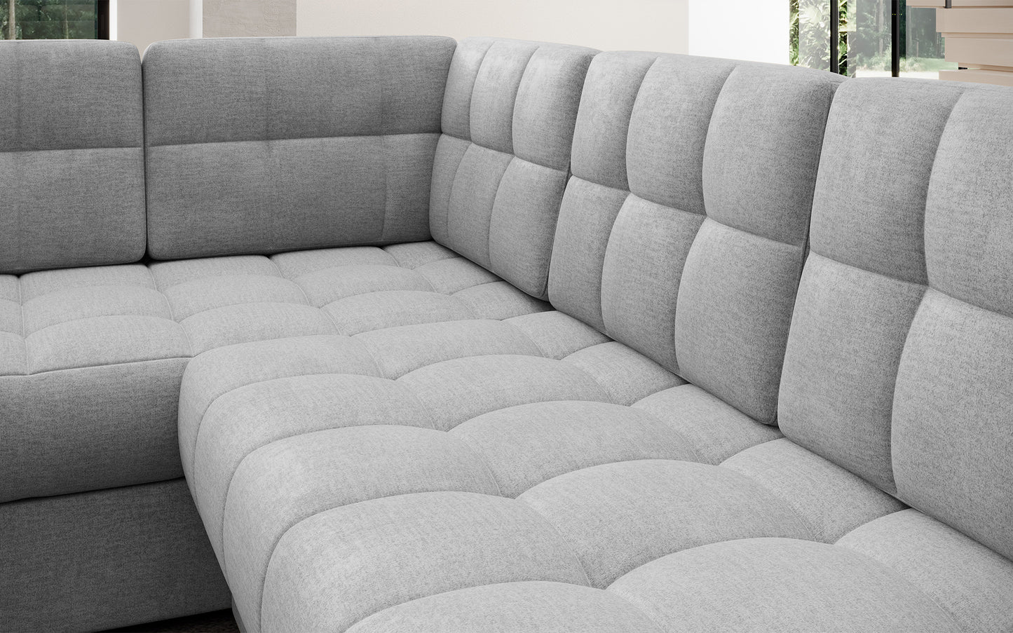 Pikowane siedzisko narożnika w wersji prawej Blewett Monolith 84 jasnoszary. Komfortowy i estetyczny detal w modnym stylu wypoczynkowym.