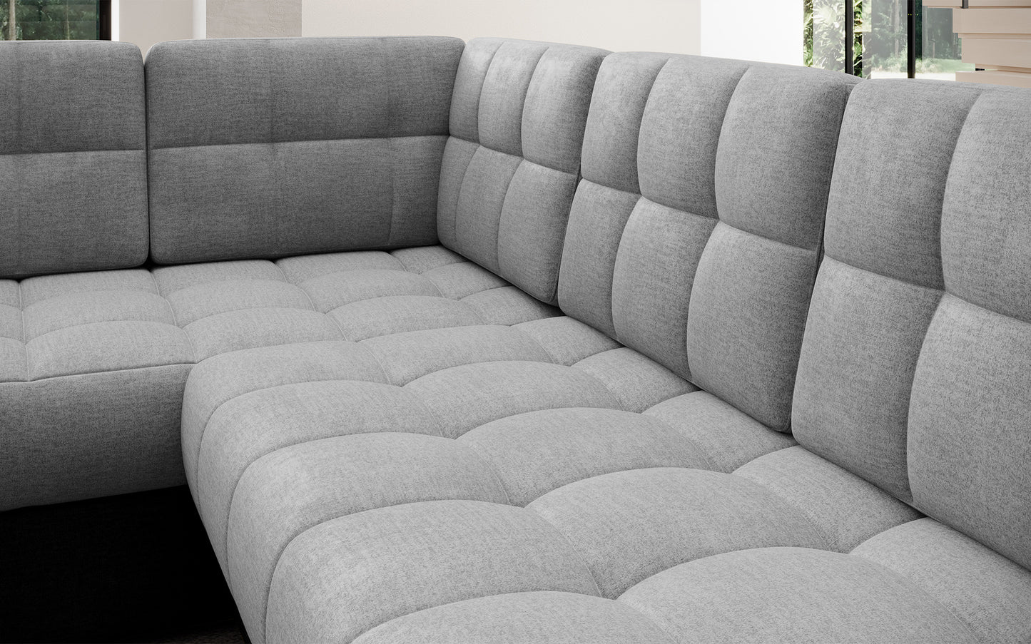 Pikowane siedzisko narożnika Blewett w jasnoszarym kolorze. Miękkie, stylowe i komfortowe do codziennego relaksu.