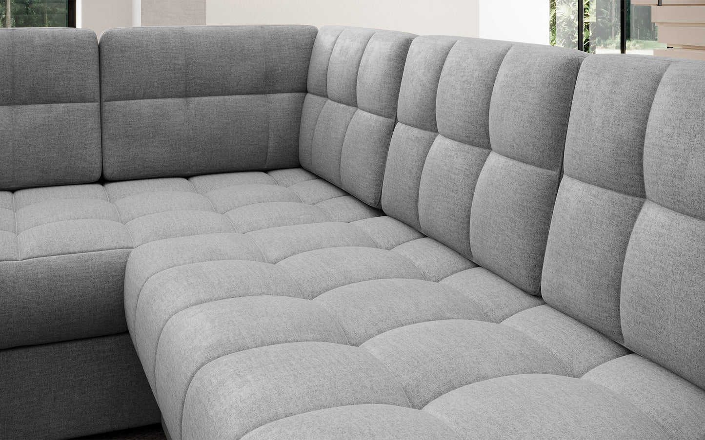 Pikowane siedzisko narożnika w wersji prawej Blewett Monolith 85 szary. Komfortowy i estetyczny detal w modnym stylu wypoczynkowym.