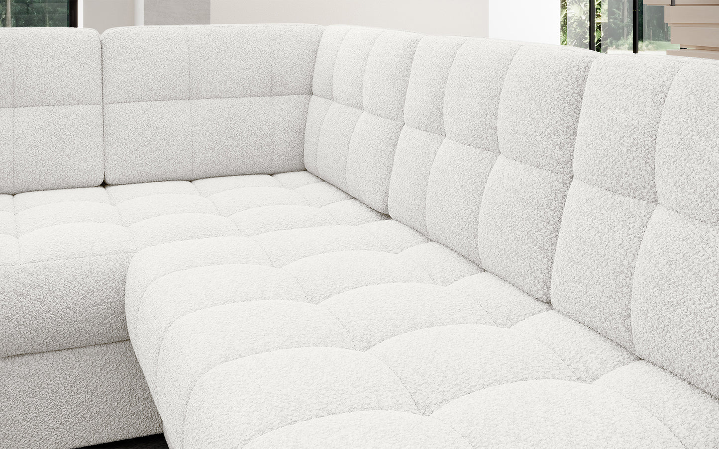 Pikowane siedzisko narożnika w wersji prawej Blewett Royal 01 biały. Komfortowy i estetyczny detal w modnym stylu wypoczynkowym.