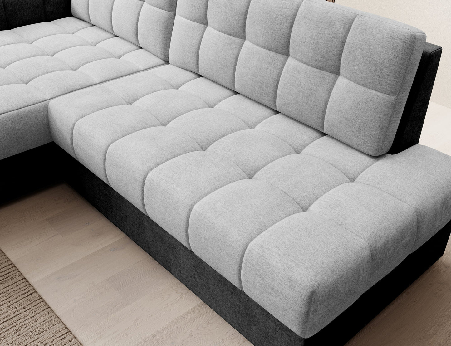 Narożne, pikowane siedzisko narożnika Blezalt lewy w jasnoszarej i ciemnoszarej tkaninie Monolith – wygodna strefa relaksu do salonu.