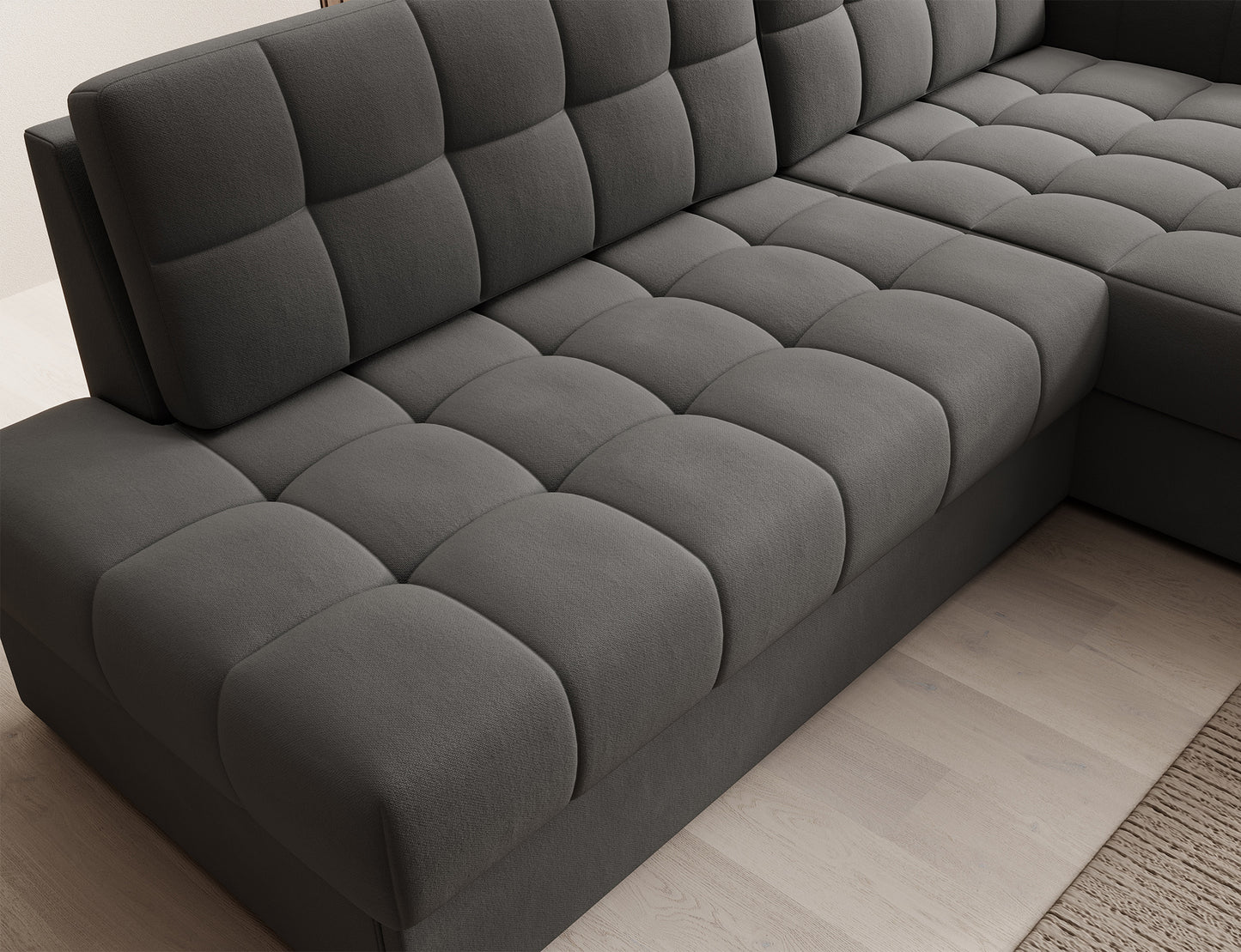 Perspektywa z góry na siedzisko narożnika Blezalt lewy Sola 06 szary – grube pikowane poduchy i wyraźna tekstura tkaniny.