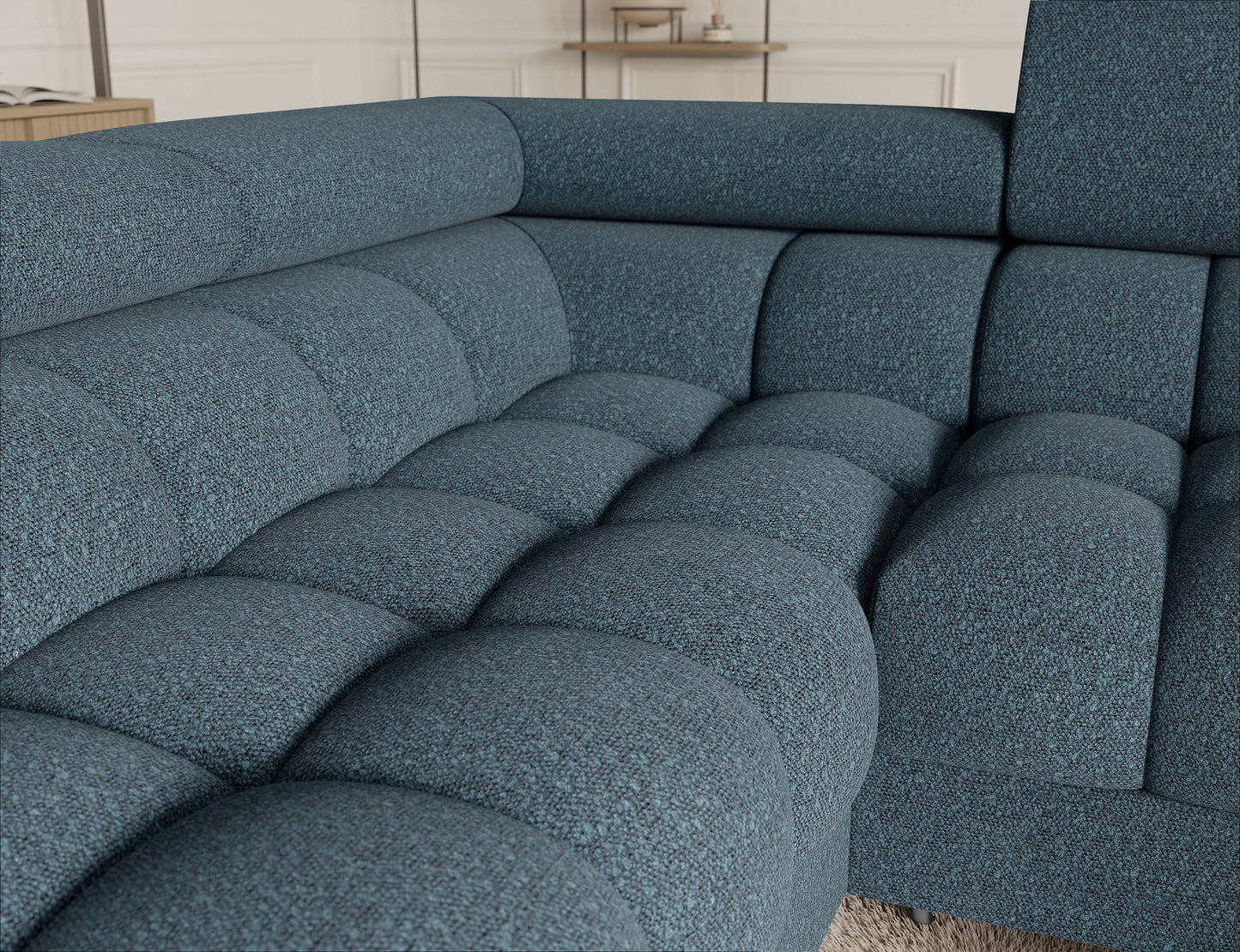 Detal narożnika Fectory w niebieskim kolorze, z widocznymi subtelnymi przeszyciami na tapicerce, nadającymi meblowi elegancji.