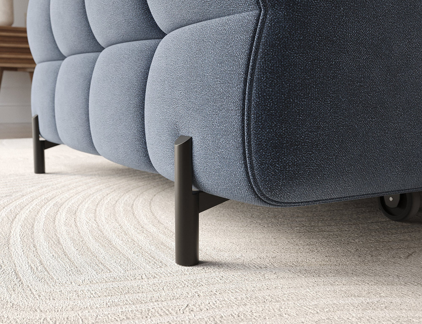 Wysokie metalowe nogi narożnika Felro w tkaninie Aura 40 w niebieskiej barwie, nowoczesny design łączący elegancję z stabilnością.