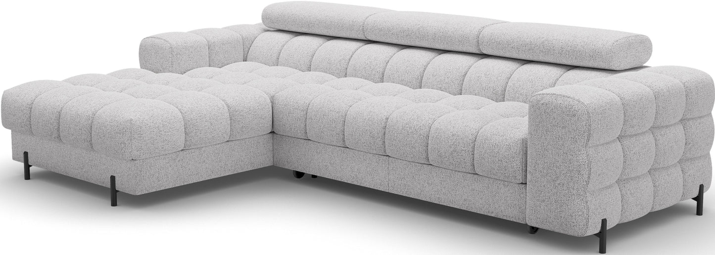 Narożnik Felro w tkaninie Pellerito 03 w jasnoszarej barwie, ustawiony na skos, elegancki design z funkcją spania i pojemnikiem na pościel.