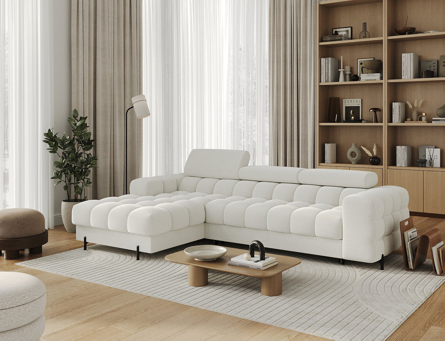 Narożnik Felro w białej barwie w dodatkowej aranżacji, harmonijnie komponuje się z wnętrzem, łącząc elegancję, komfort i funkcjonalność.