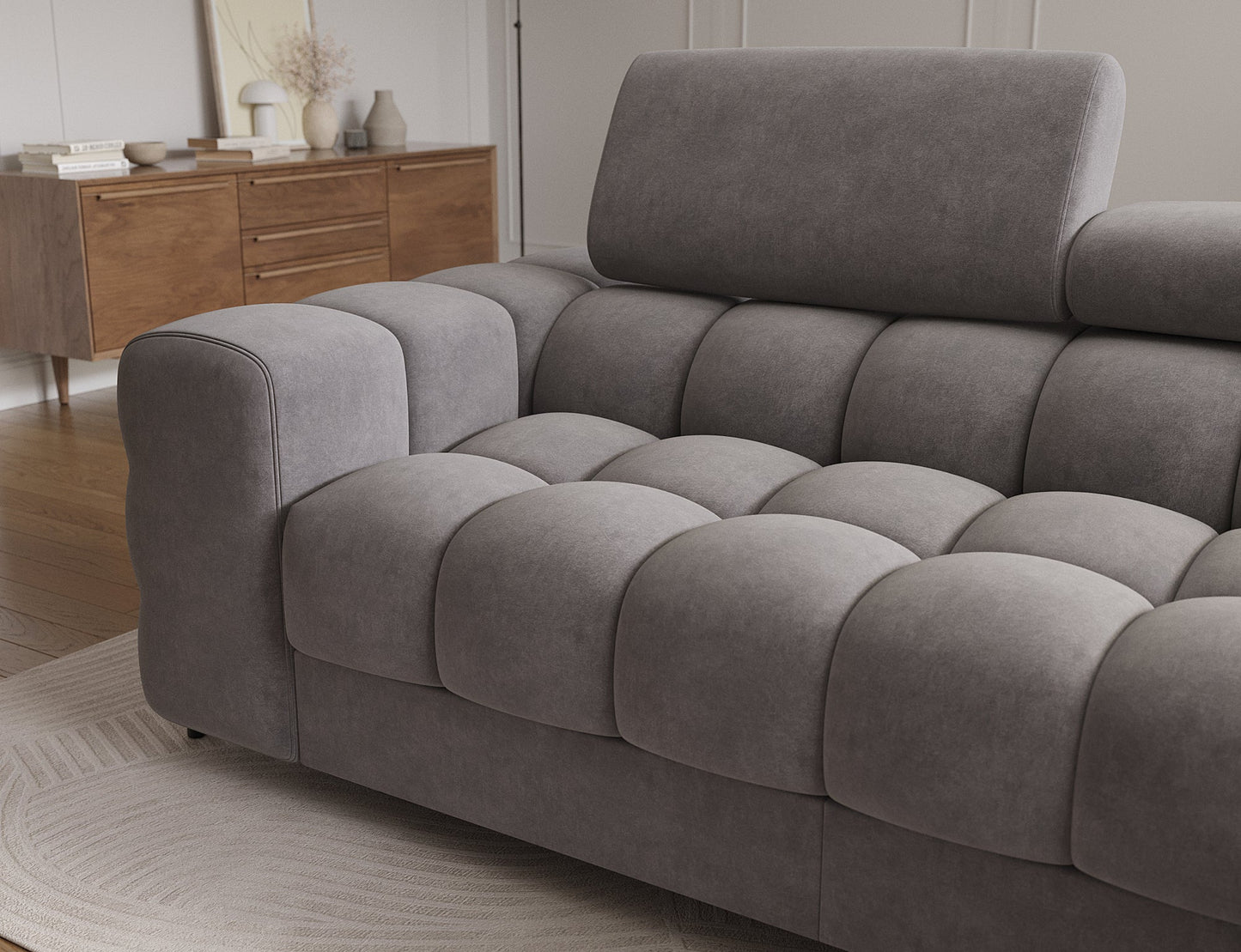 Detal narożnika Felro – eleganckie pikowanie siedziska oraz ergonomiczny, regulowany zagłówek zapewniają wygodę i nowoczesny styl.