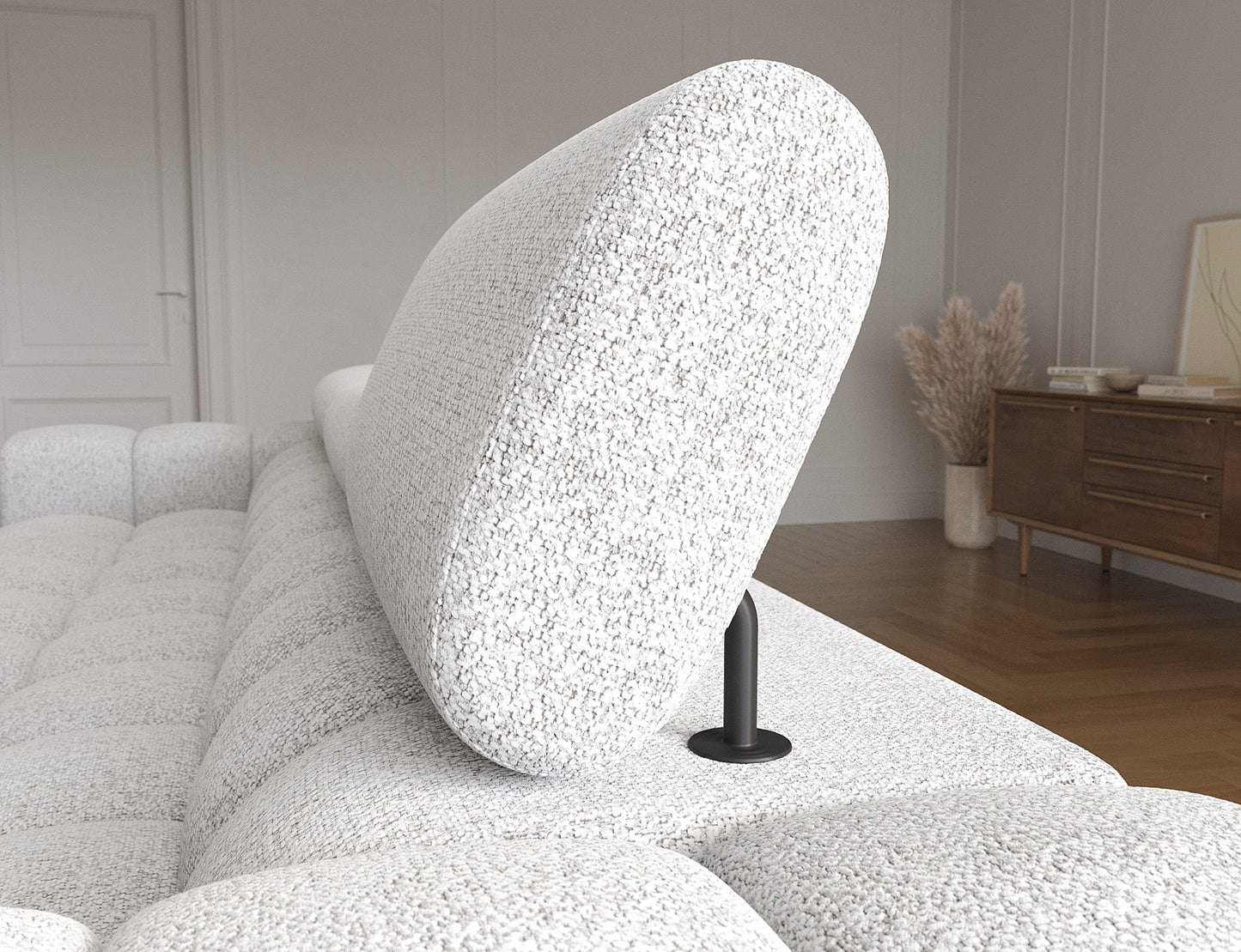 Ruchomy zagłówek narożnika Felro w tkaninie Pellerito 03 w jasnoszarej barwie, zapewniający regulację dla optymalnego komfortu podczas odpoczynku.