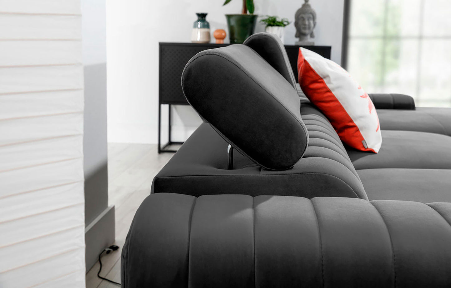 Regulowany zagłówek narożnika Grayson w kolorze Nube 04 szary – detal prezentujący wygodne oparcie i wysoką jakość wykonania.