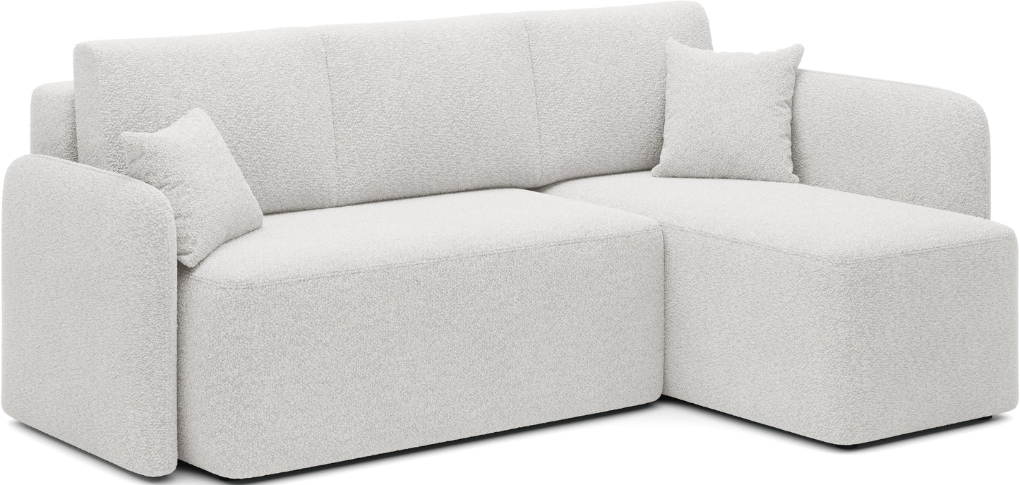 Jasny narożnik tapicerowany z szezlongiem i poduszkami – nowoczesny design do salonu.