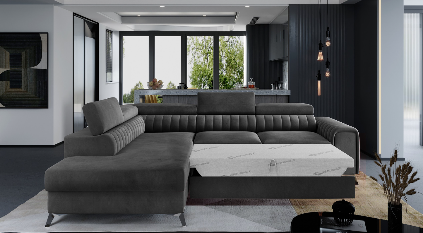 Narożnik Laurence w tkaninie Monolith 97 ciemnoszary, układ lewy, rozłożony z funkcją spania zapewniającą wygodny odpoczynek.