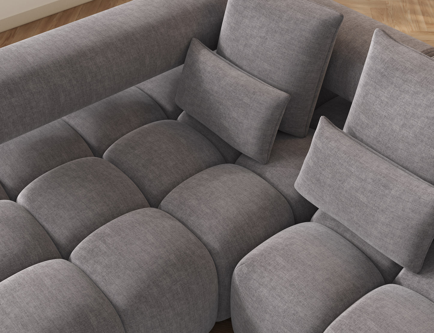 Zbliżenie na siedzisko narożnika Levvi ELTAP w jasnoszarym welurze easy clean, staranne przeszycia i miękka tapicerka