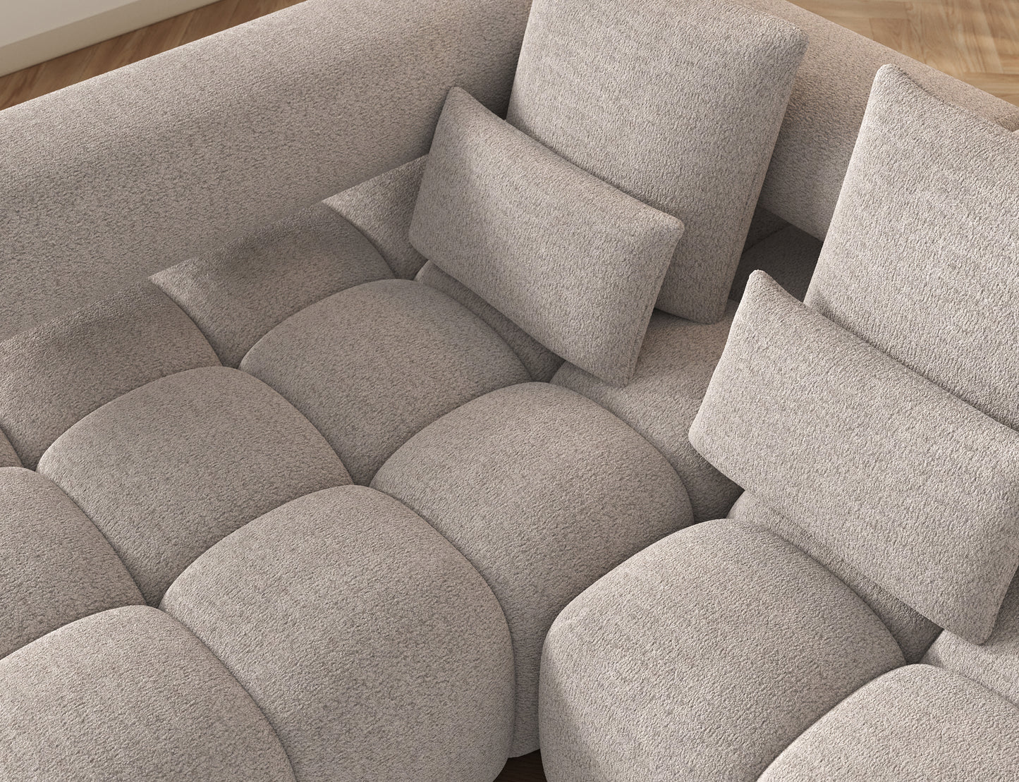 Narożnik Levvi lewy Royal 18 jasnobeżowy miękka boucle, detal siedziska z pikowaniami, podkreślający miękkość i nowoczesne wykończenie.