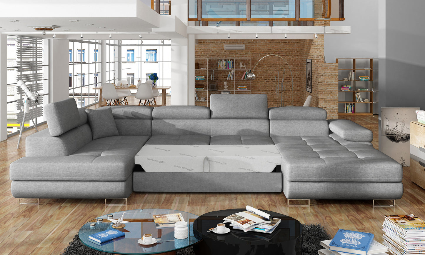Narożnik Rodrigo Cover 87 ciemnoszary w układzie lewym z rozłożoną funkcją spania w jasnym salonie.
