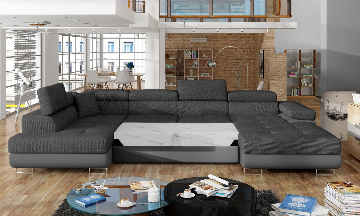 Narożnik Rodrigo Inari 96 ciemnoszary / Soft 29 w układzie lewym z rozłożoną funkcją spania w jasnym salonie.
