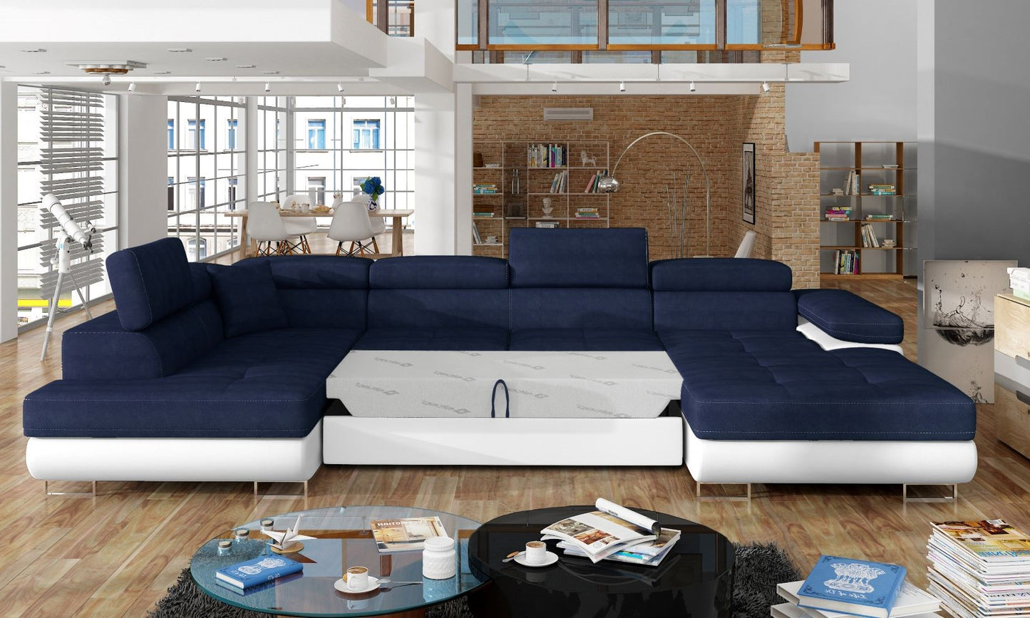 Narożnik Rodrigo Kronos 09 granatowy / Soft 17 w układzie lewym z rozłożoną funkcją spania w jasnym salonie.