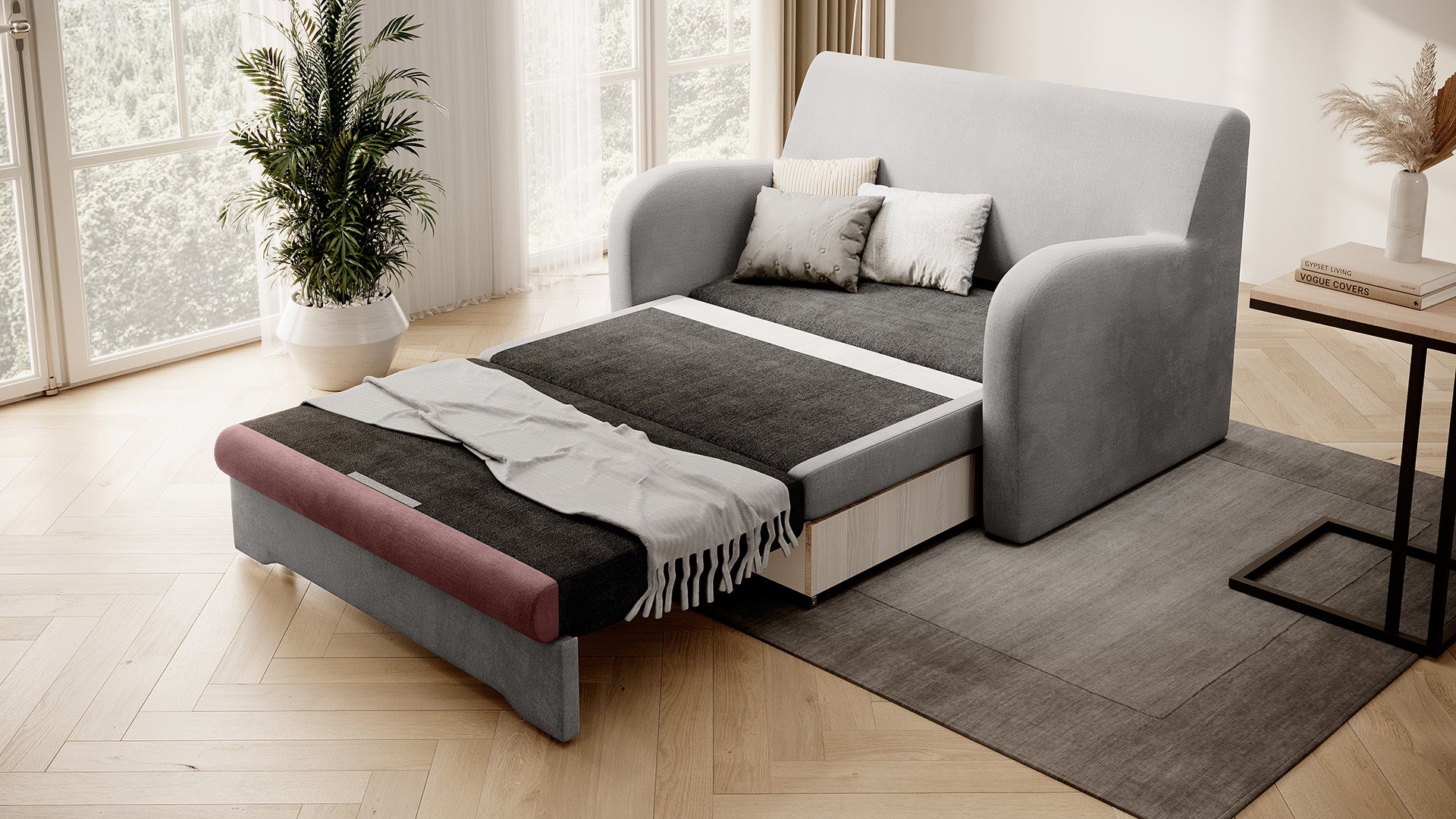 Sofa Ario jasnoszara z akcentami w pudrowym różu, rozłożona do spania; ujęcie skośne.