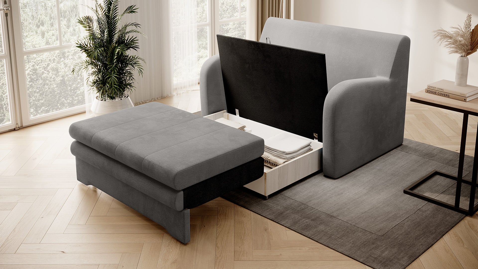 Szara sofa Ario z otwartym pojemnikiem na pościel; ujęcie skośne w salonie.