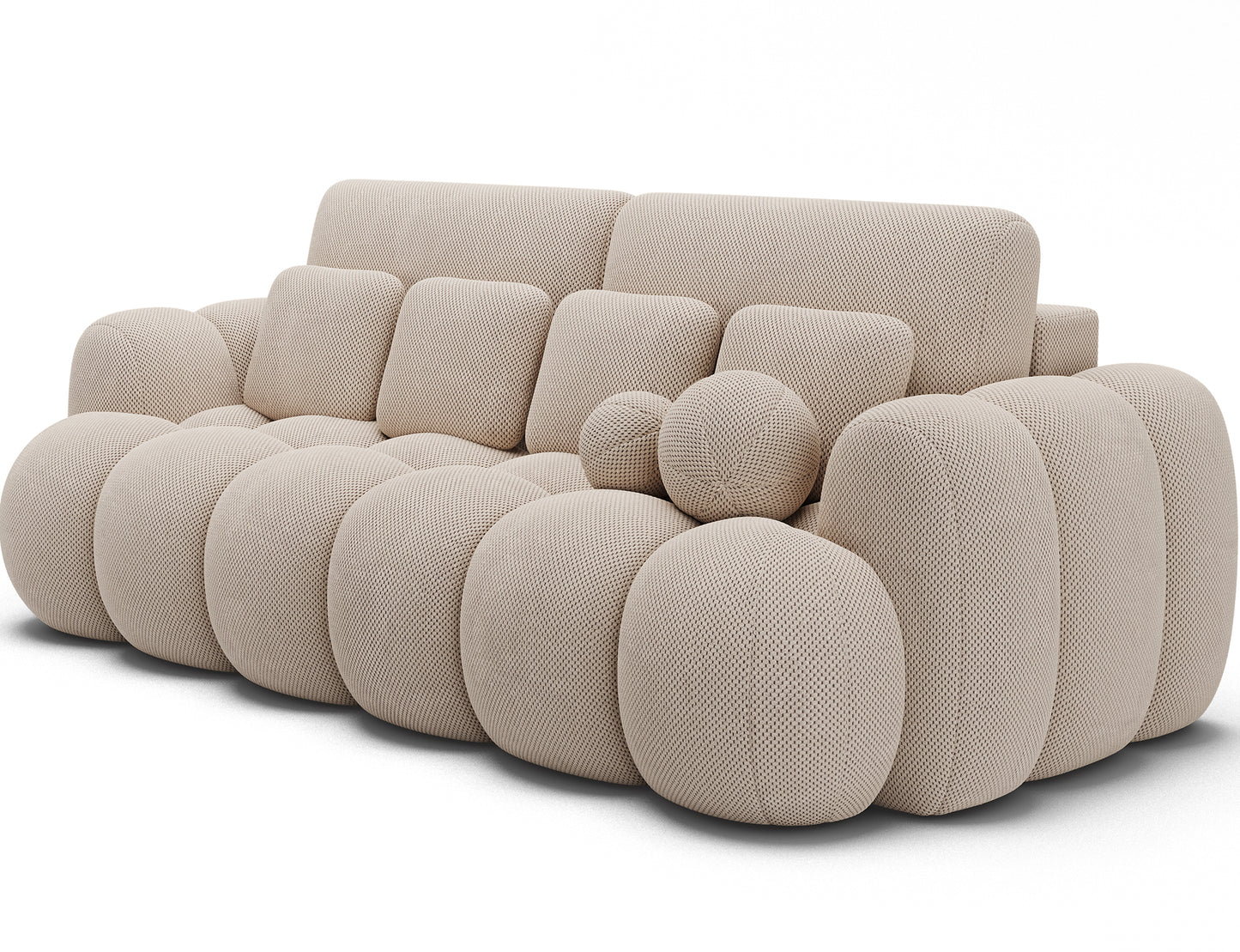 Cotonn Calmora 18 – beżowa sofa o obłej formie, z poduchami dekoracyjnymi. Miękki komfort i styl w eleganckim salonie.