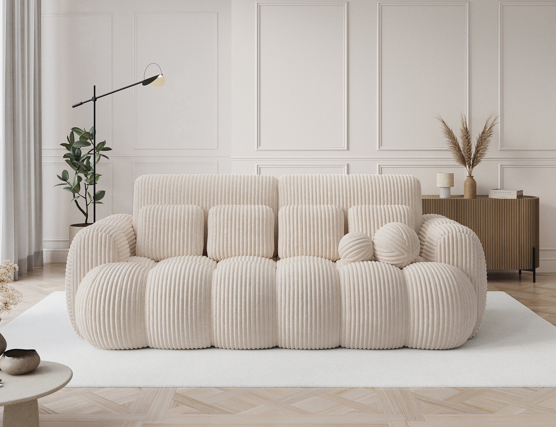 Designerska sofa Cotonn Modullo 3-osobowa w białym sztruksie – elegancka dekoracja salonu w stylu modern classic, z poduszkami dekoracyjnymi.