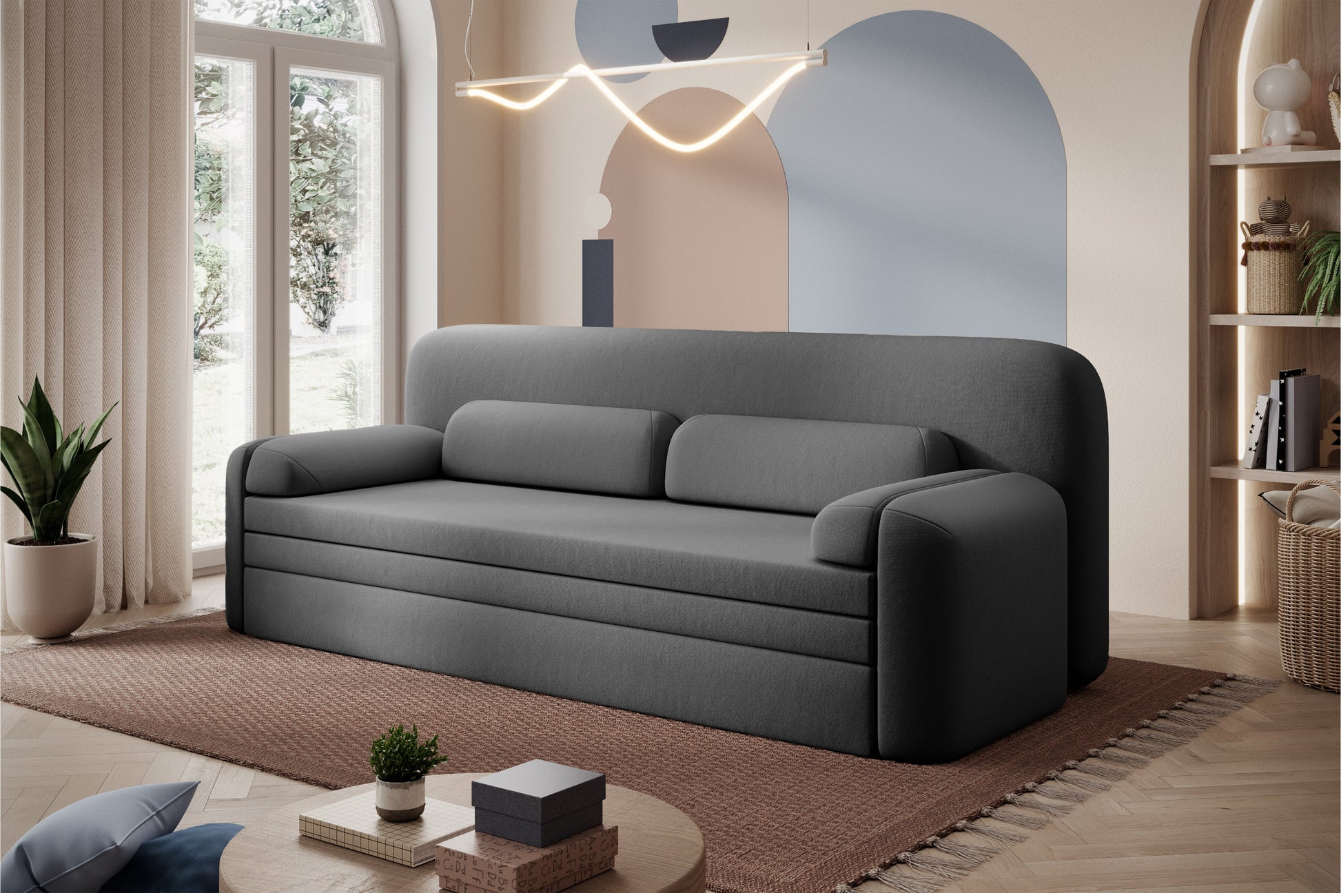 Sofa Elioss Sola 06 w ciemnoszarym kolorze – nowoczesna forma i tapicerka w stylowej aranżacji wnętrza z pastelową ścianą.
