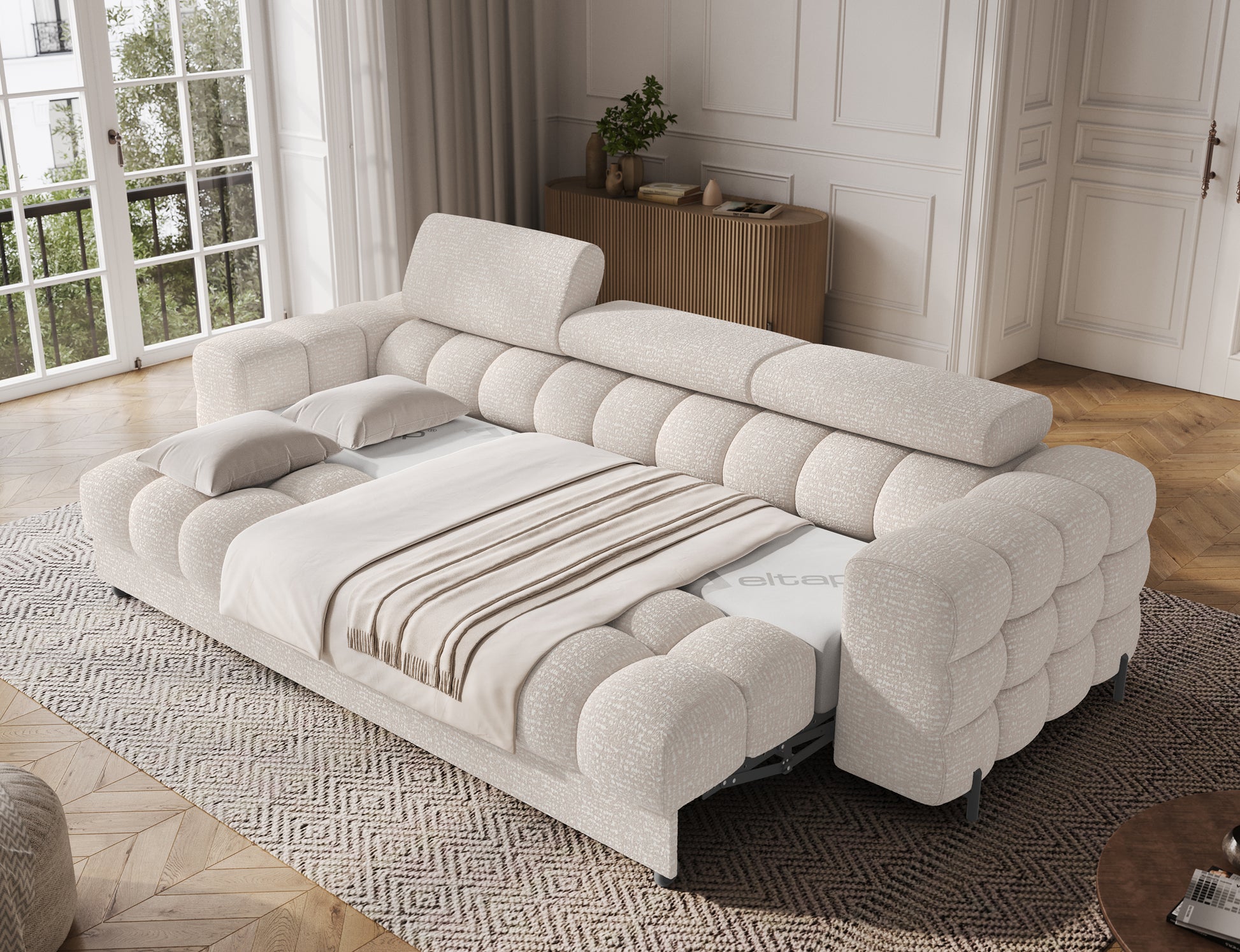 Sofa Festello Baffix 20 beżowa z funkcją spania, rozłożona w przestronnym salonie, idealna do codziennego użytku.