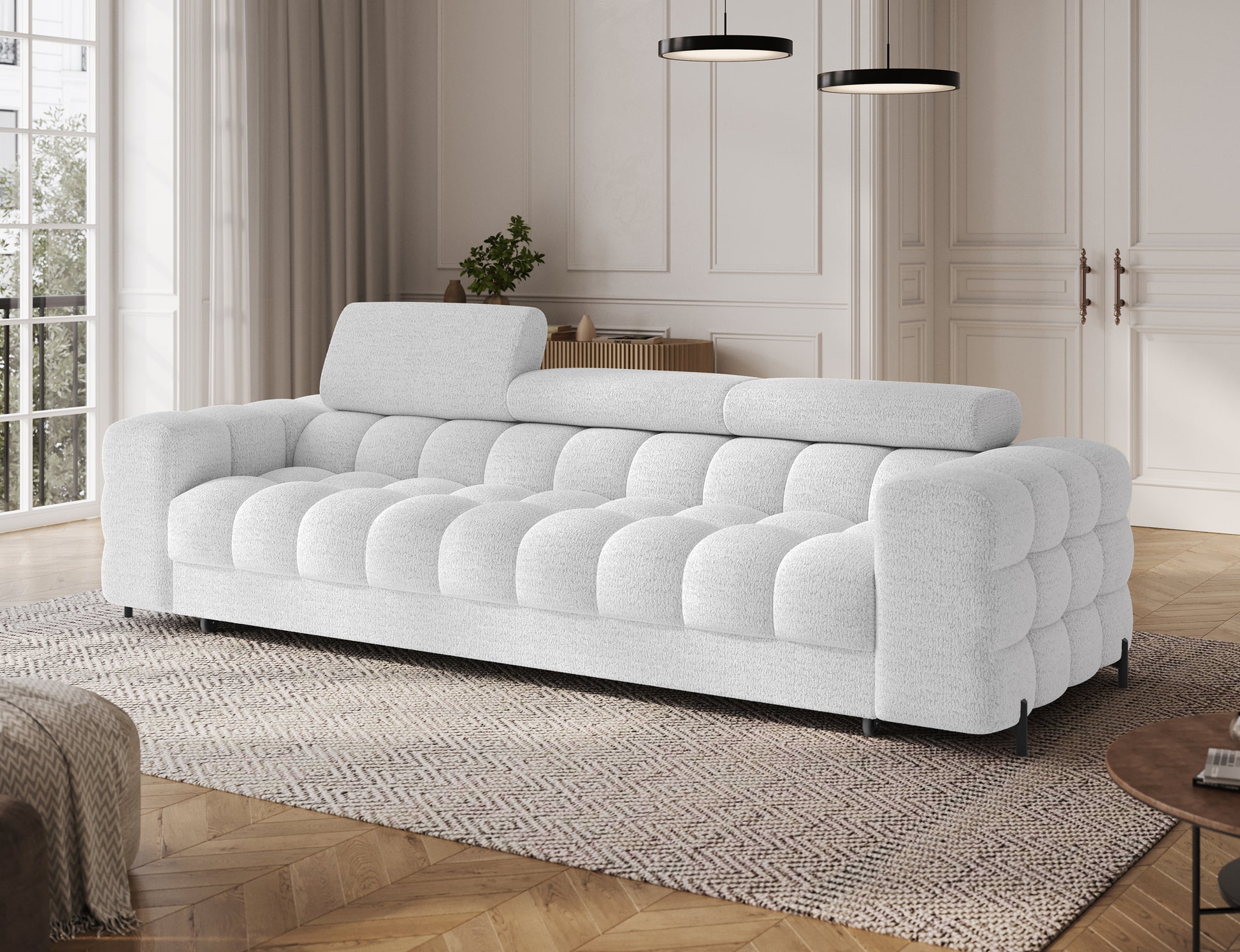 Sofa Festello Royal 01 biała z funkcją spania – widok skośny, nowoczesny design i regulowane zagłówki.