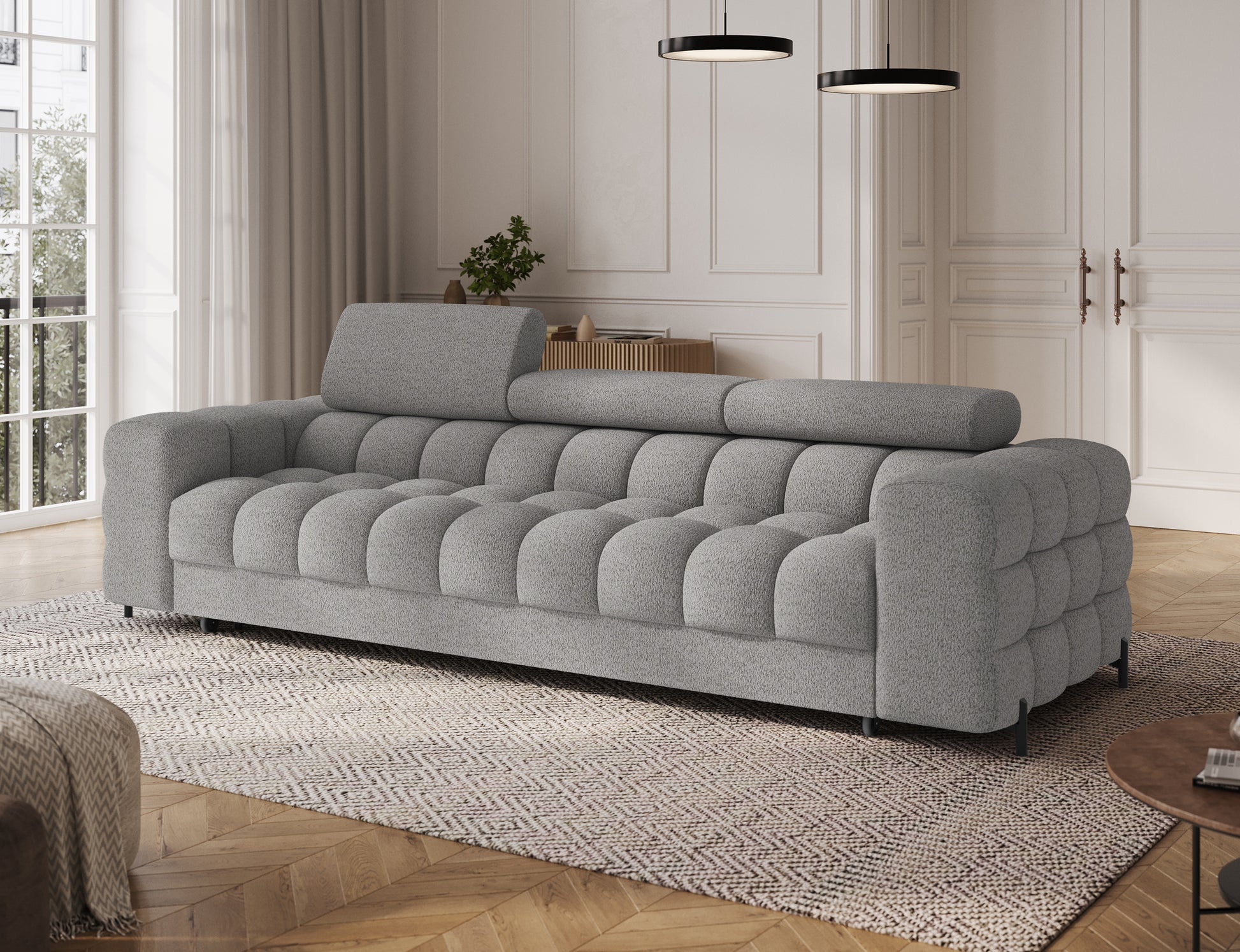 Sofa Festello Royal 04 szara z funkcją spania – widok skośny, nowoczesny design i regulowane zagłówki do eleganckiego salonu.