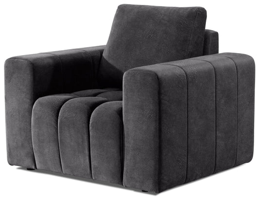 Fotel Lazaro w tkaninie Dora 95 w głębokim ciemnoszarym kolorze, zaprezentowany na białym tle. Nowoczesny design z szerokimi podłokietnikami i efektownym pikowaniem siedziska.