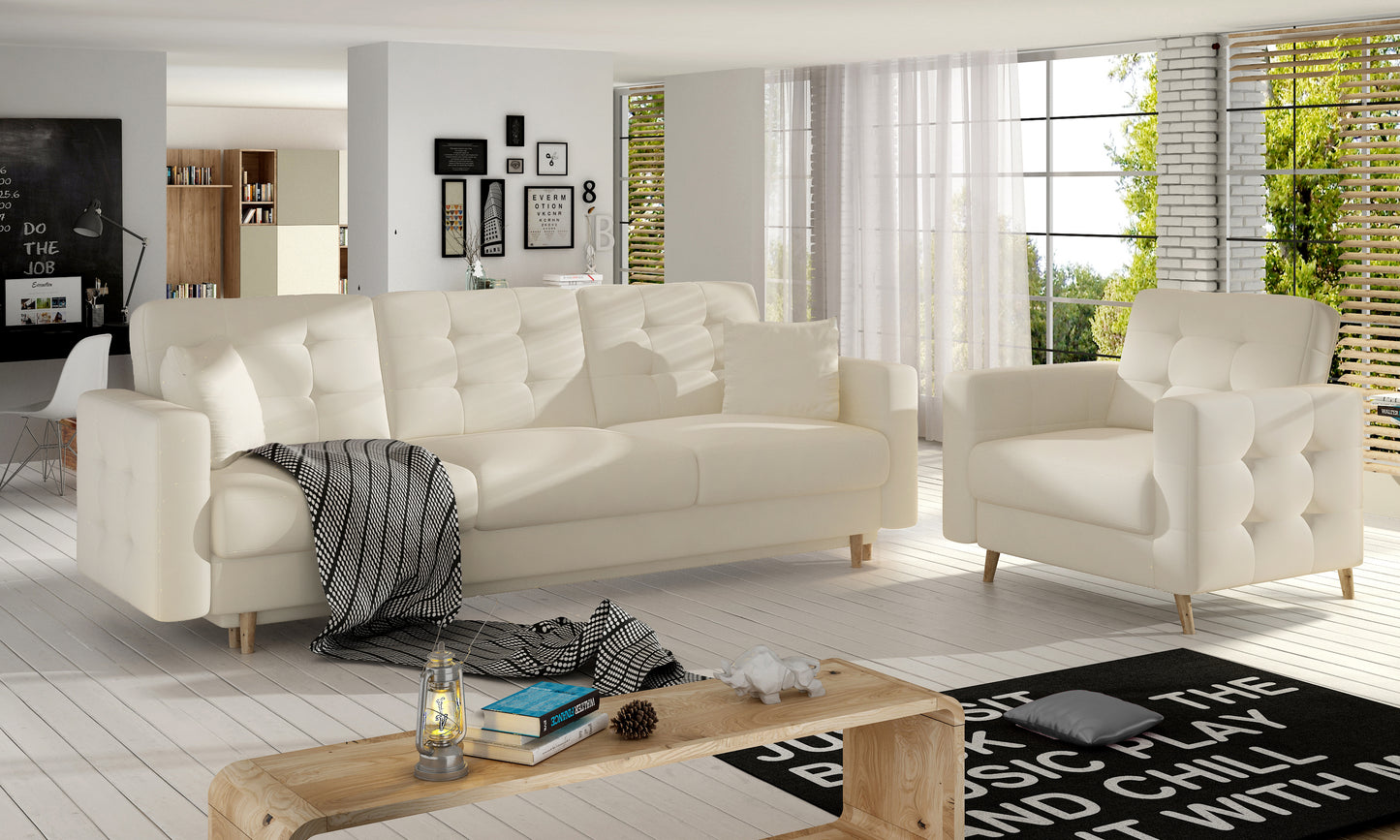 Sofa i fotel Asgard Soft w jasnym beżu tworzą spójną strefę wypoczynku w salonie. Prosta forma mebli podkreśla nowoczesny charakter aranżacji.