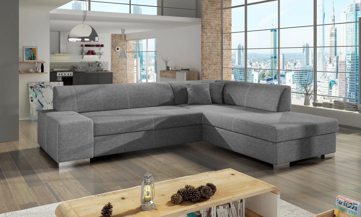 Szara sofa narożna Porto wykonana z materiału Sawana 21 w układzie prawym doskonale sprawdzi się w nowoczesnych i minimalistycznych wnętrzach, oferując komfort użytkowania oraz estetyczny wygląd