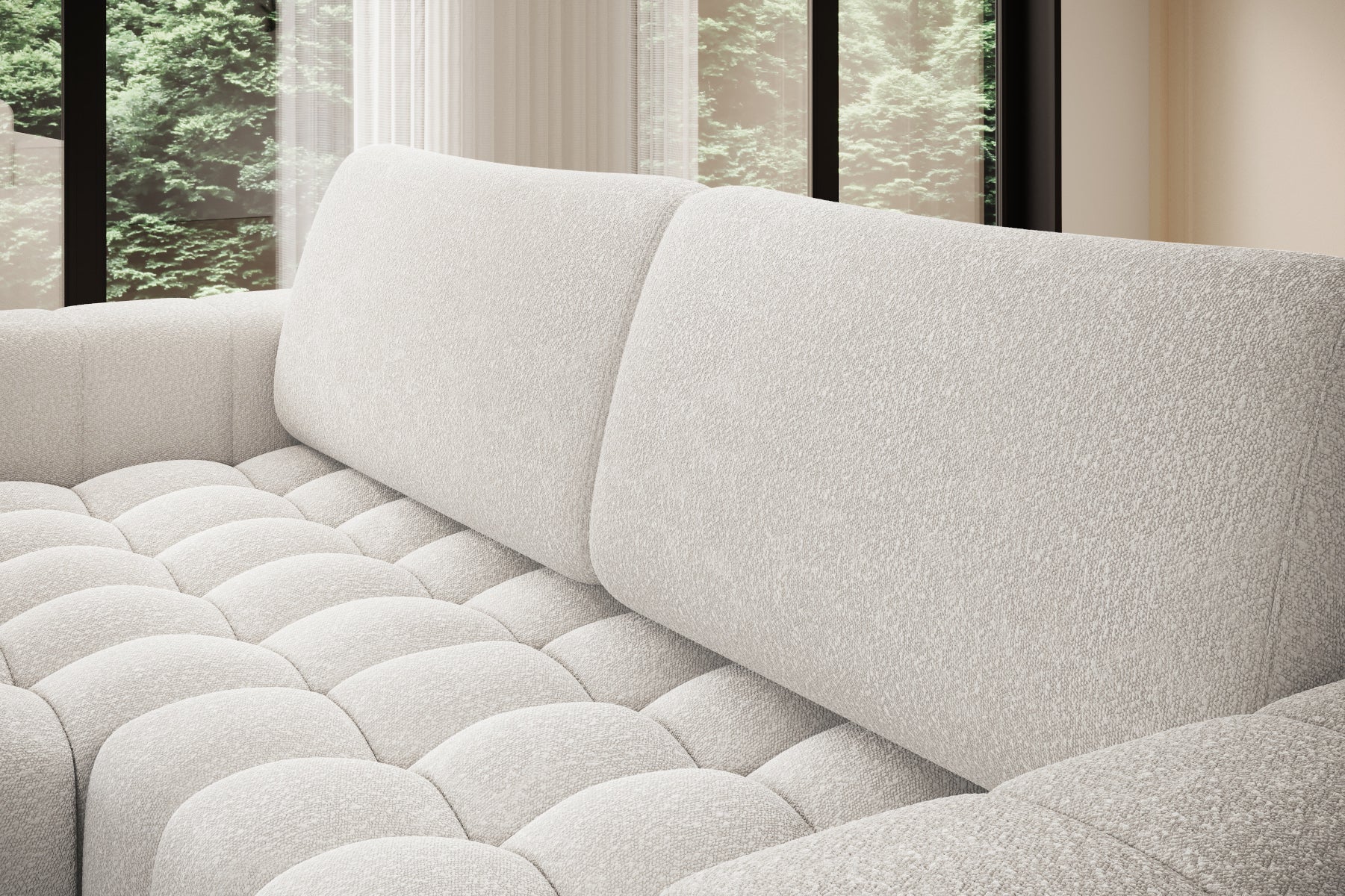 Zbliżenie na miękkie, pikowane siedzisko narożnika Bonett w białej tkaninie.