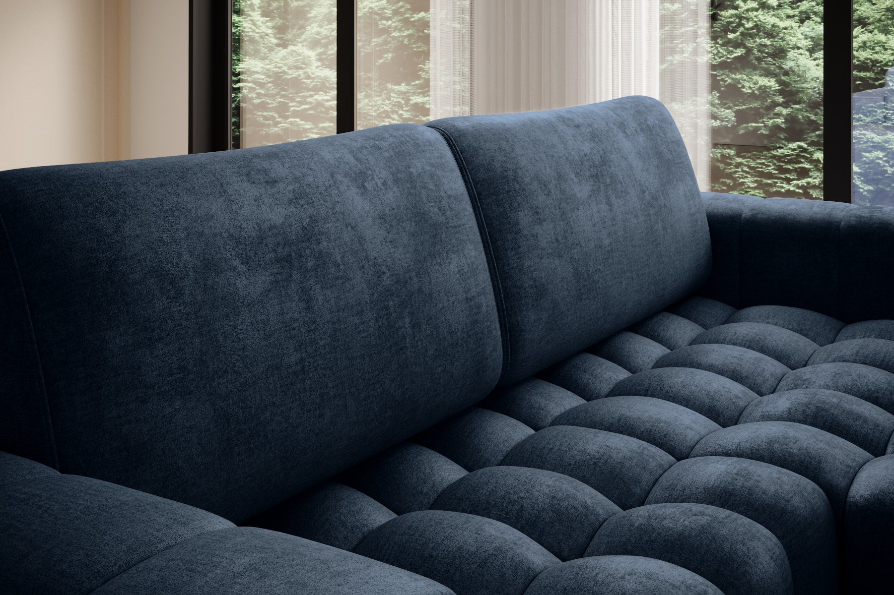 Zbliżenie na miękkie, głęboko pikowane siedzisko narożnika Bonett – Monolith 77 niebieski.